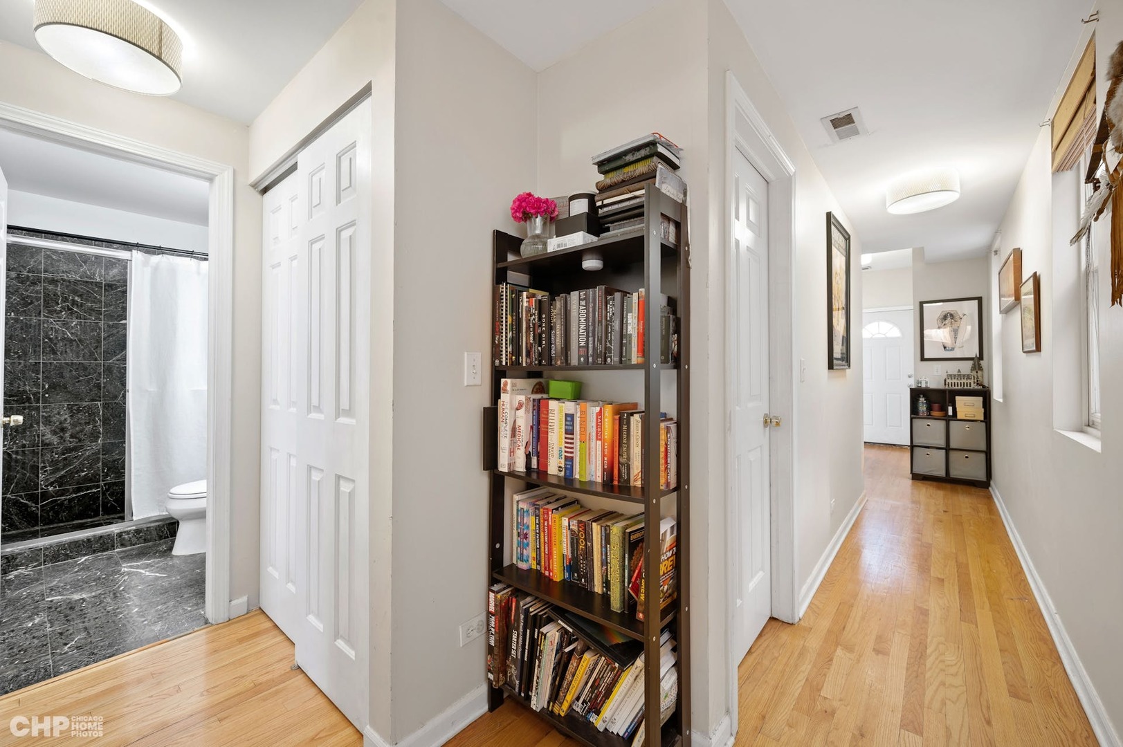 2349 West Harrison Street, Unit 3 Chicago, IL 60612 - Photo 14 of 26 a view of a hallway with wooden floor and stairs