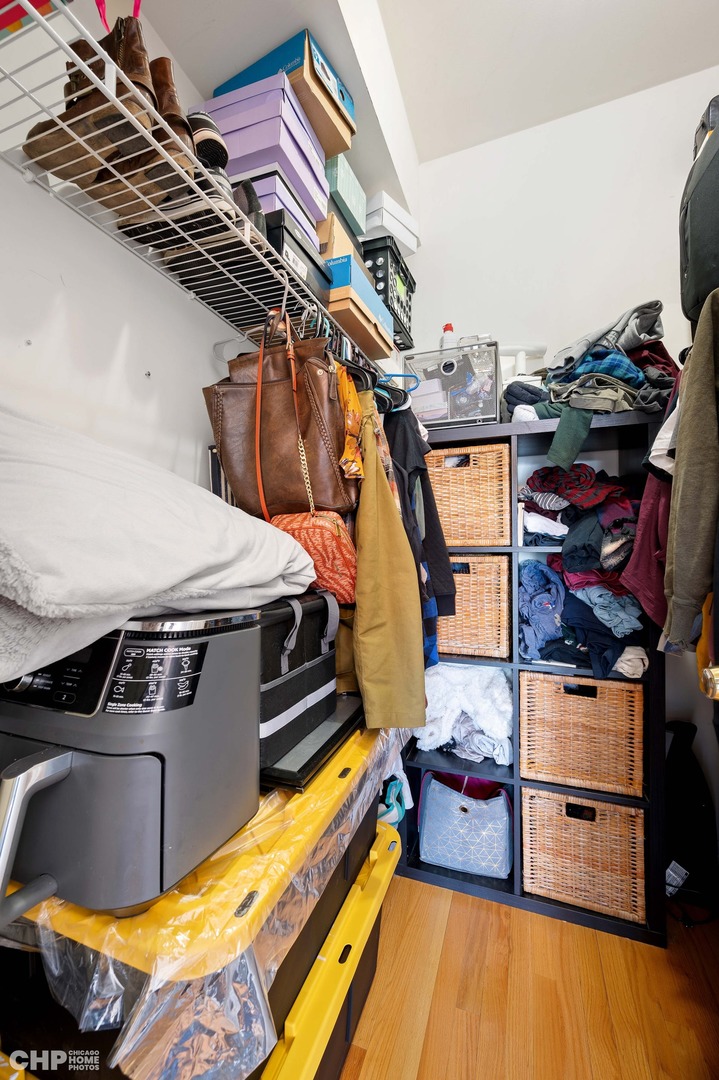 2349 West Harrison Street, Unit 3 Chicago, IL 60612 - Photo 17 of 26 a bed room with a bed and a couch