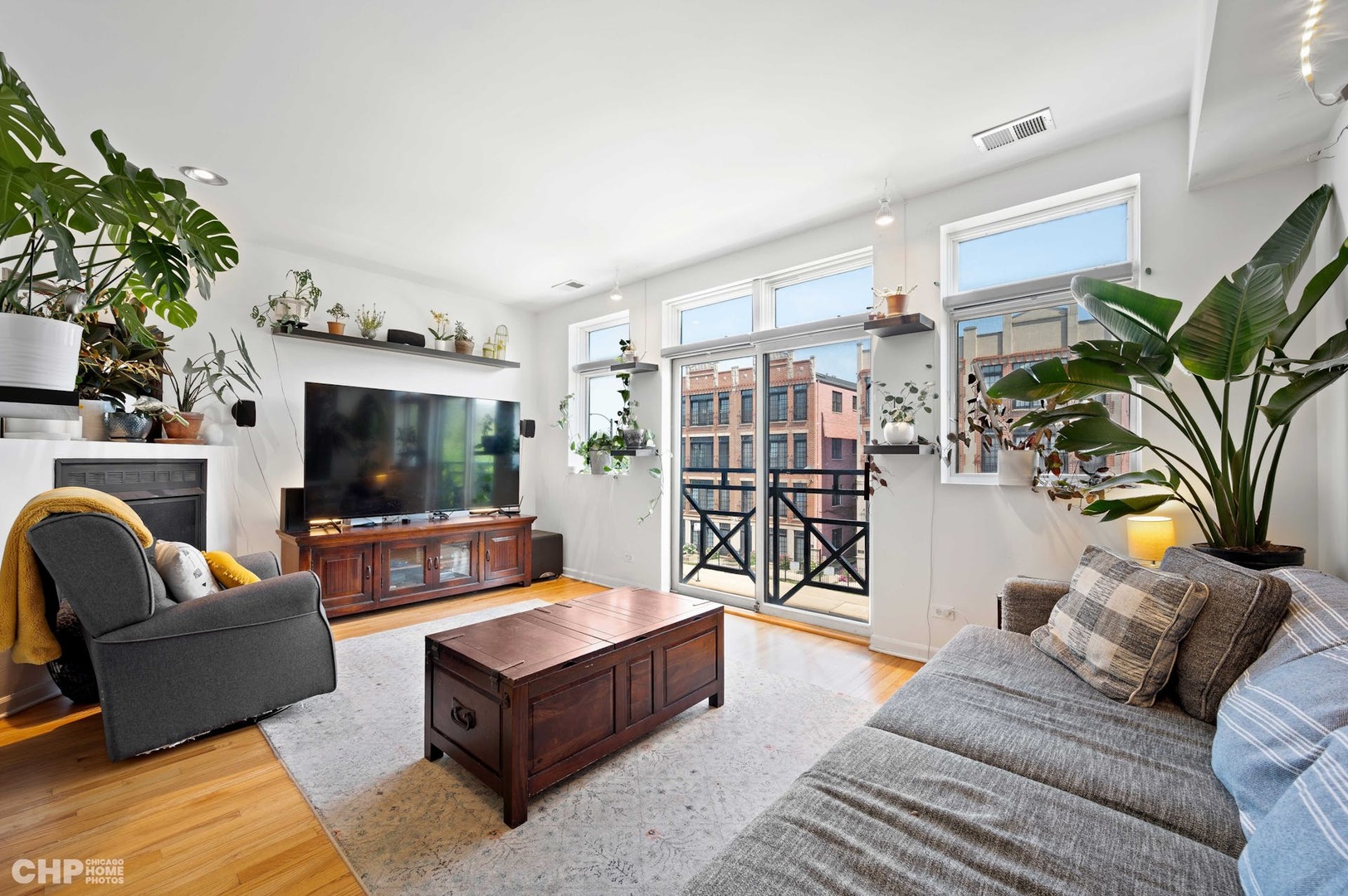 2349 West Harrison Street, Unit 3 Chicago, IL 60612 - Photo 2 of 26 a living room with furniture and a flat screen tv