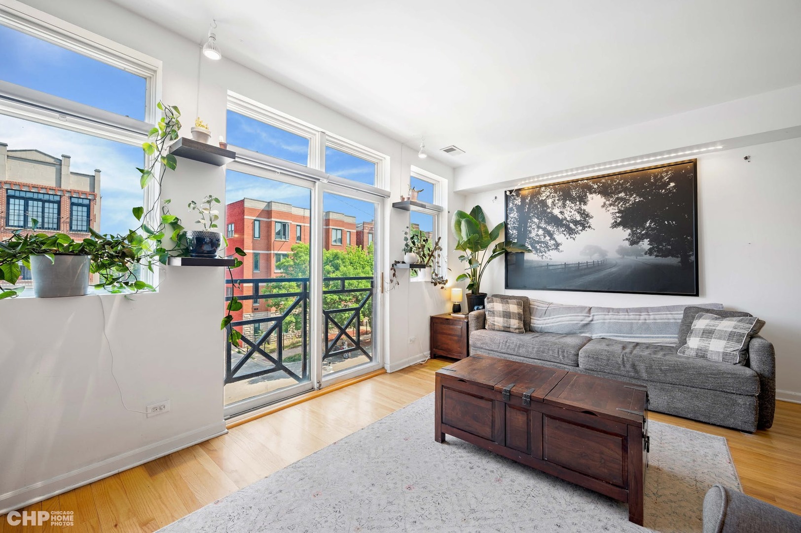 2349 West Harrison Street, Unit 3 Chicago, IL 60612 - Photo 4 of 26 a living room with furniture and a large window