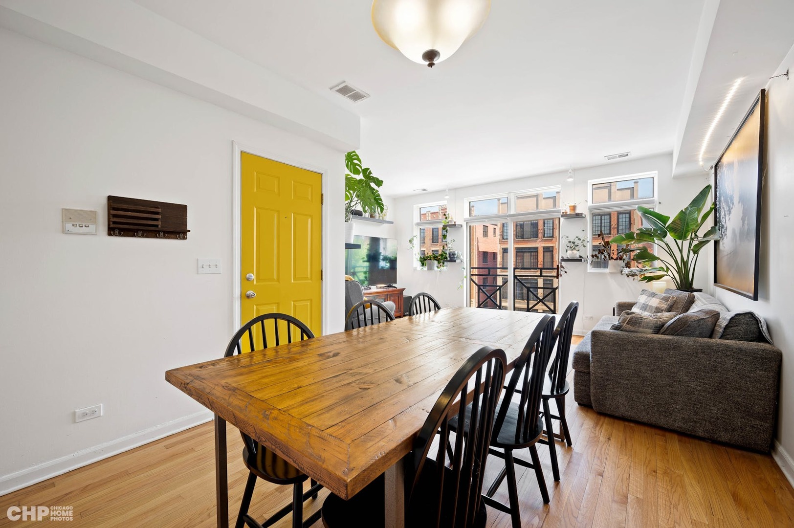 2349 West Harrison Street, Unit 3 Chicago, IL 60612 - Photo 8 of 26 a view of a dining room with furniture and wooden floor