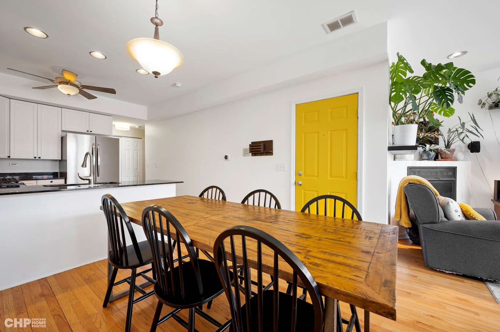 2349 West Harrison Street, Unit 3 Chicago, IL 60612 - Photo 9 of 26 a view of a dining room with furniture and wooden floor