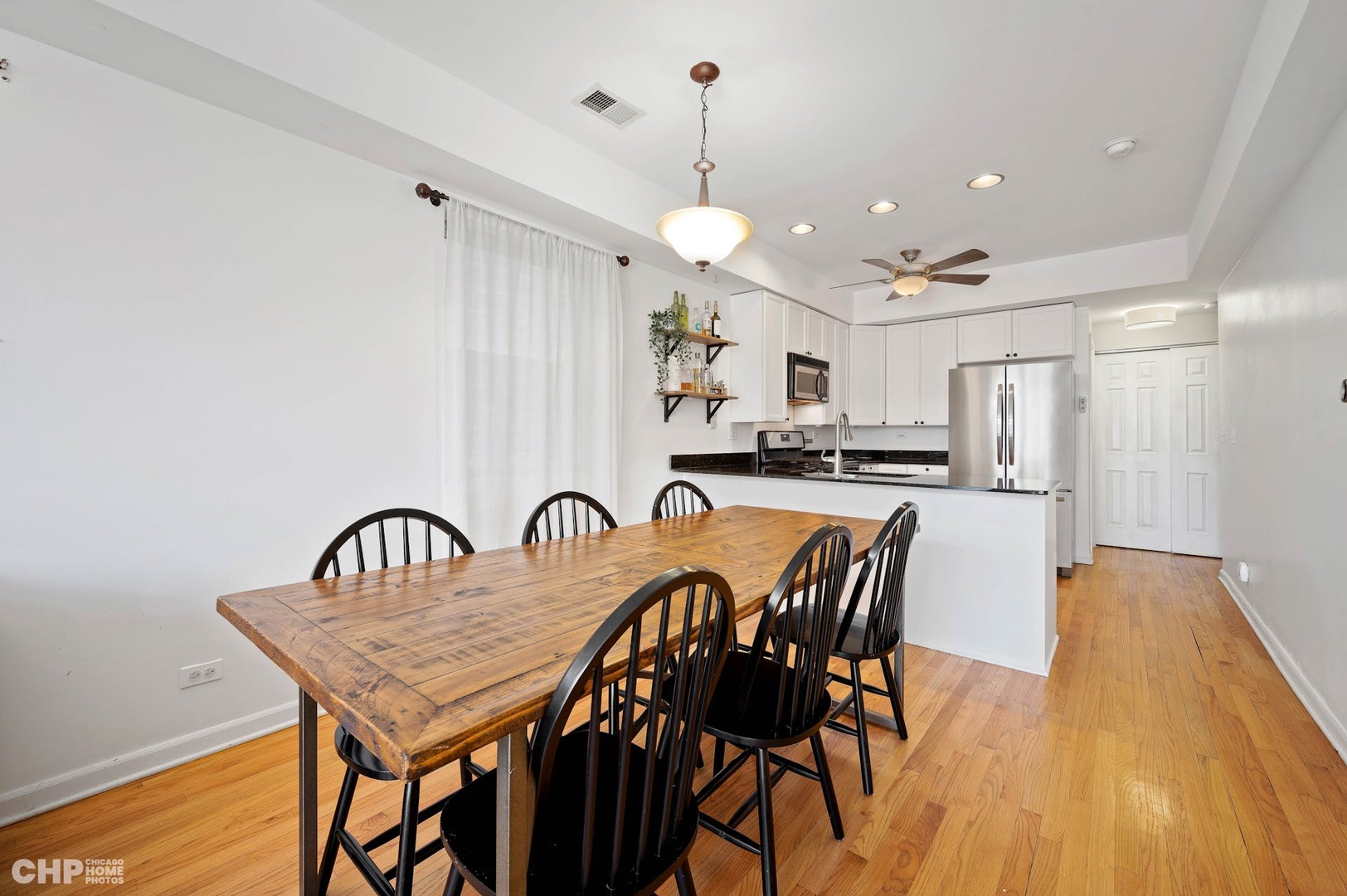 2349 West Harrison Street, Unit 3 Chicago, IL 60612 - Photo 10 of 26 a dining room with furniture and window