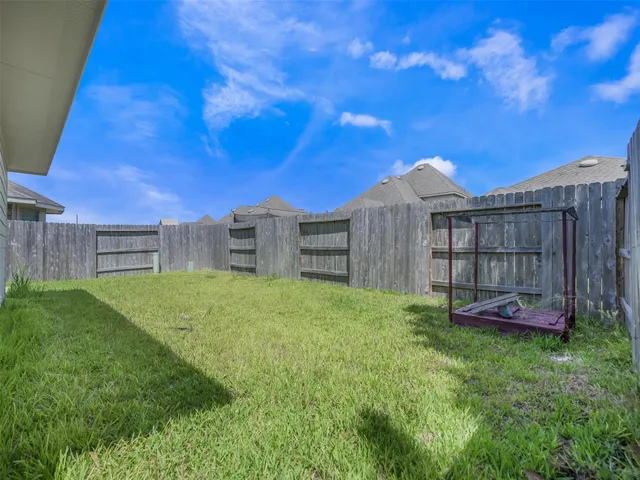 a view of a backyard with a small cabin