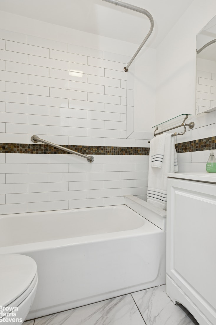 251 Rutland Road Brooklyn, NY 11225 - Photo 11 of 16 a bathroom with bathtub and shower