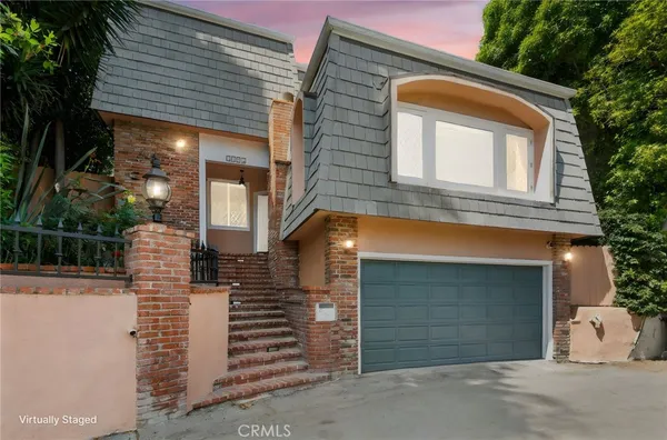 a front view of a house with a garage