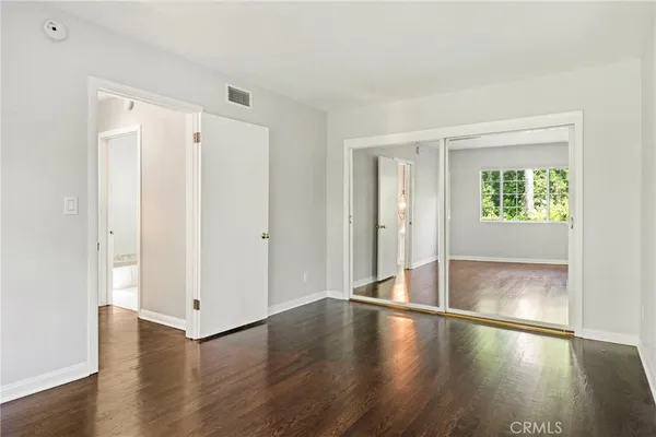 a view of a patio with table and chairs and potted plants