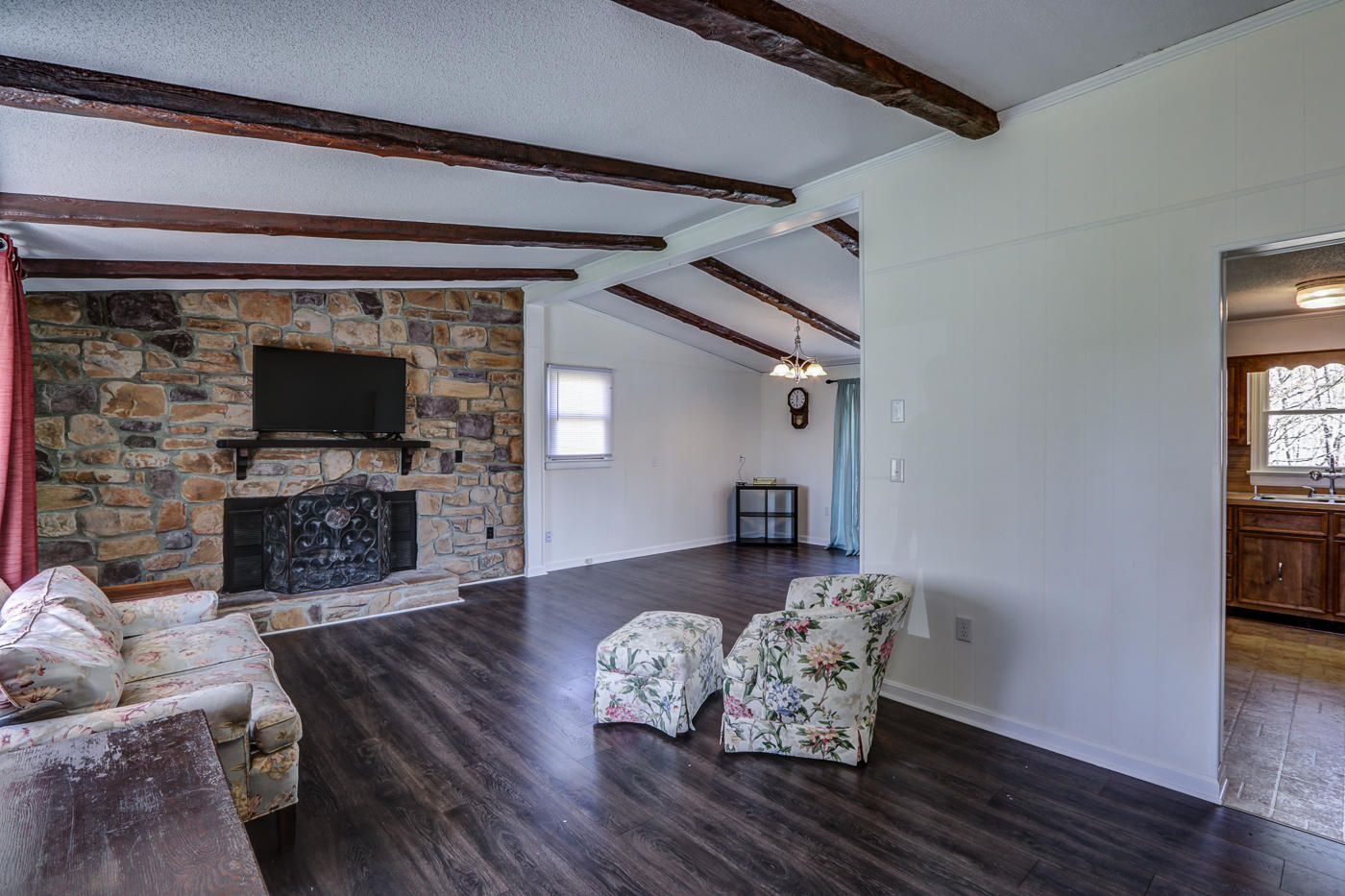 1306 Gills Road Bedford, VA 24523 - Photo 2 of 65 a living room with furniture a fireplace and a flat screen tv