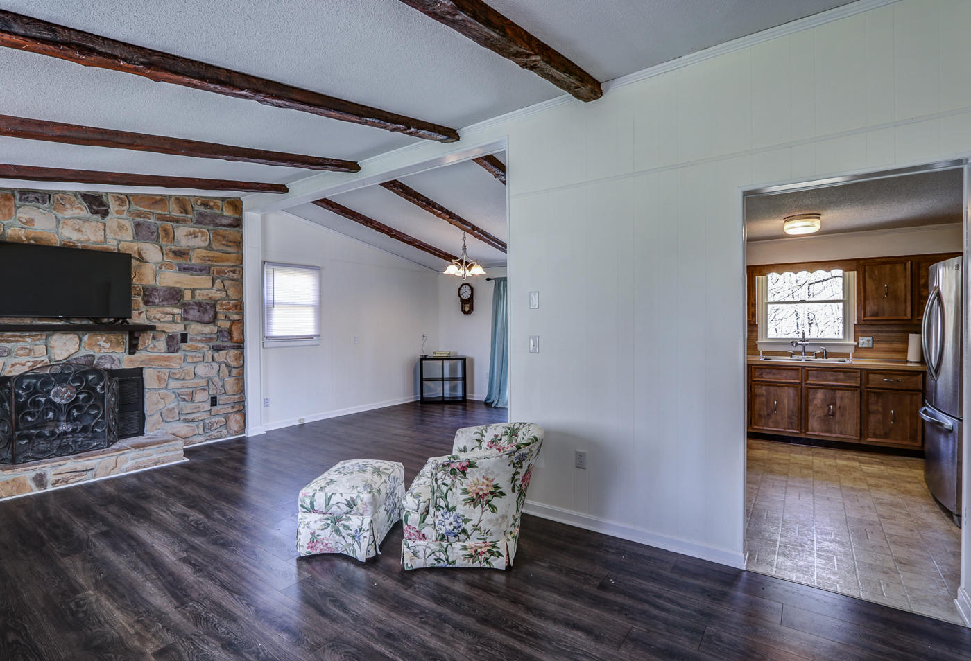 1306 Gills Road Bedford, VA 24523 - Photo 20 of 65 a living room with furniture wooden floor and a fireplace