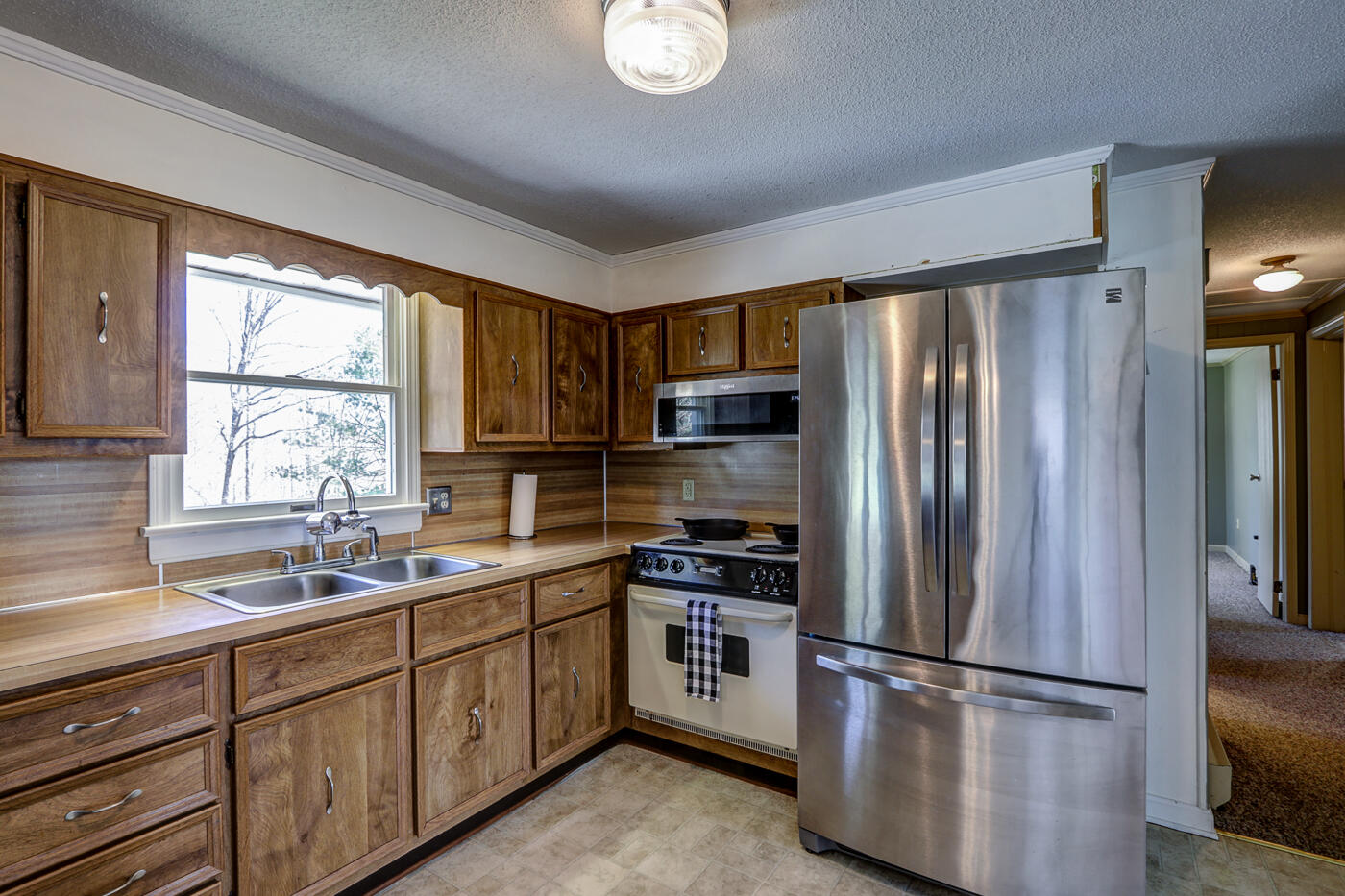 1306 Gills Road Bedford, VA 24523 - Photo 23 of 65 a kitchen with stainless steel appliances granite countertop a refrigerator sink and stove