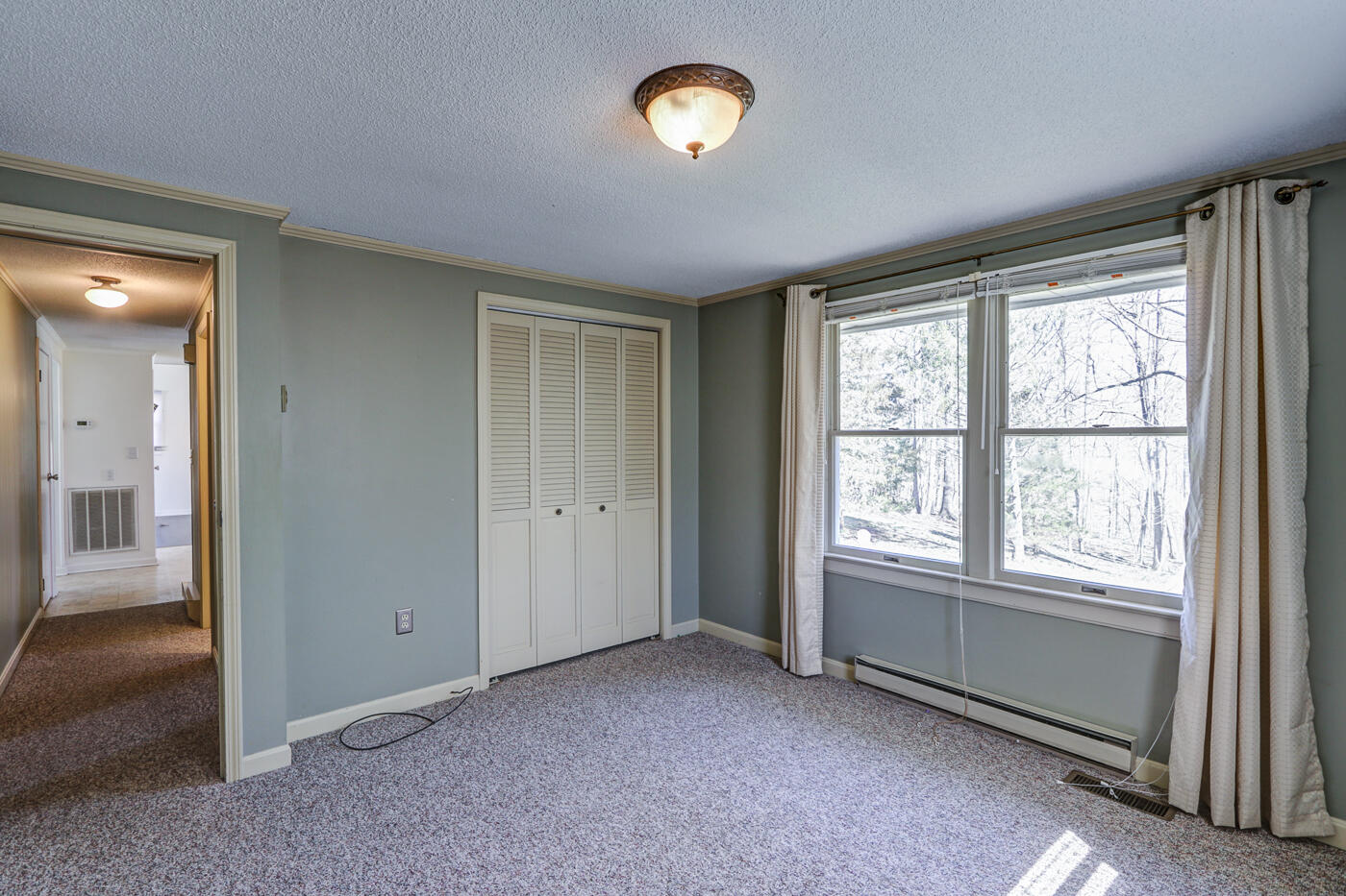 1306 Gills Road Bedford, VA 24523 - Photo 30 of 65 an empty room with a fan and a window