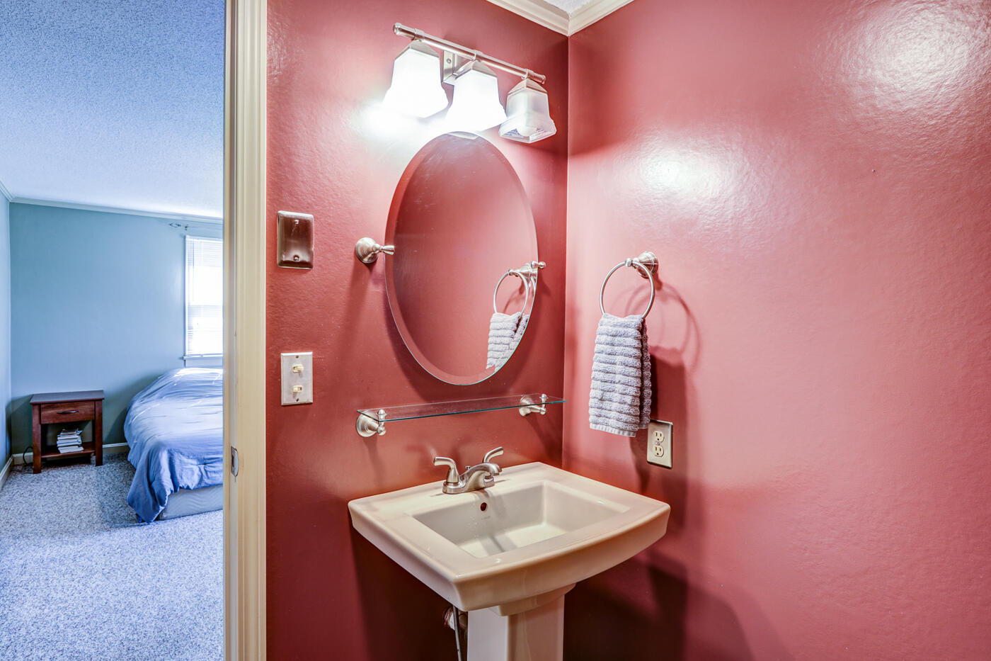 1306 Gills Road Bedford, VA 24523 - Photo 35 of 65 a bathroom with a sink a mirror and a lamp