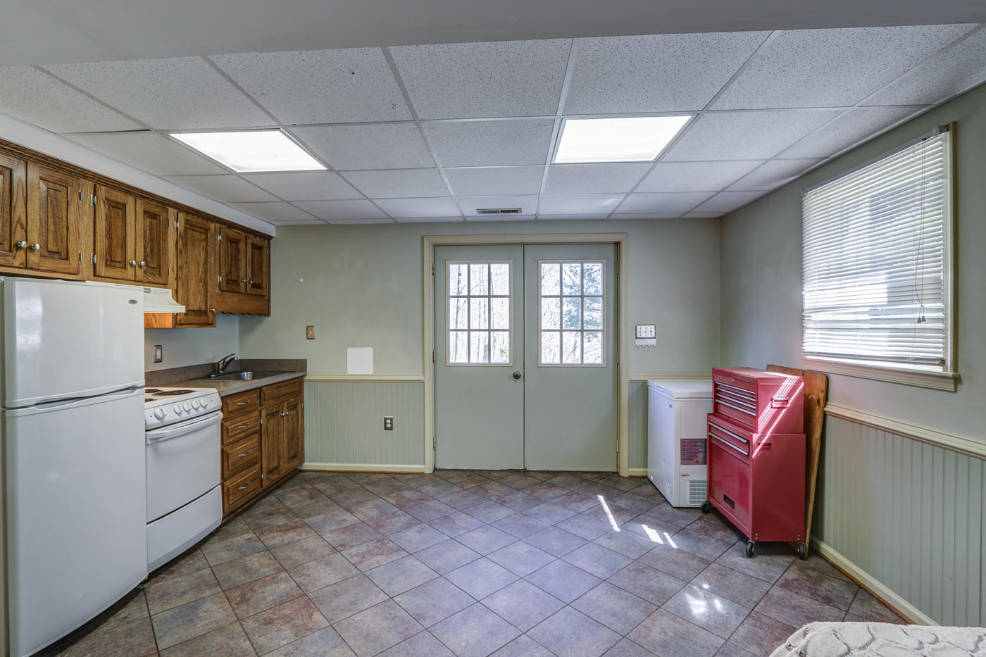 1306 Gills Road Bedford, VA 24523 - Photo 40 of 65 a kitchen with refrigerator and window