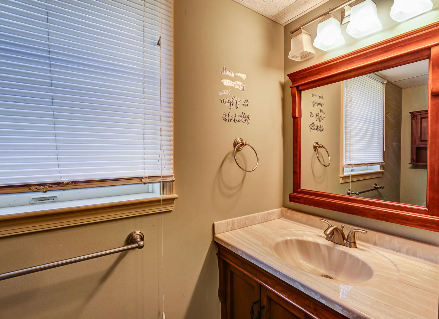 1306 Gills Road Bedford, VA 24523 - Photo 45 of 65 a bathroom with a sink and a mirror