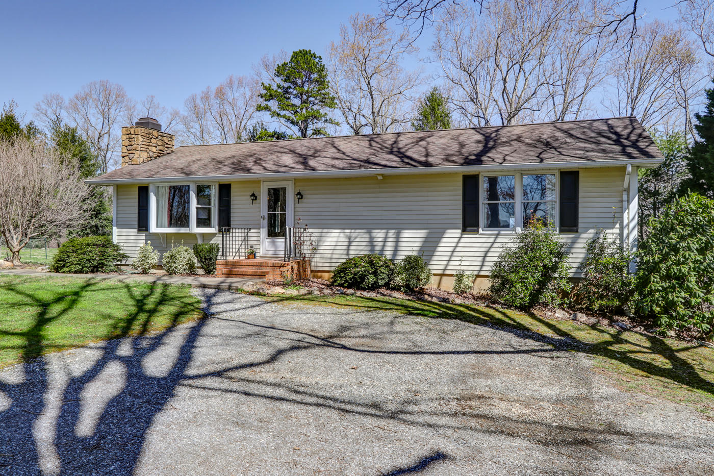 1306 Gills Road Bedford, VA 24523 - Photo 54 of 65 a front view of a house with garden and porch