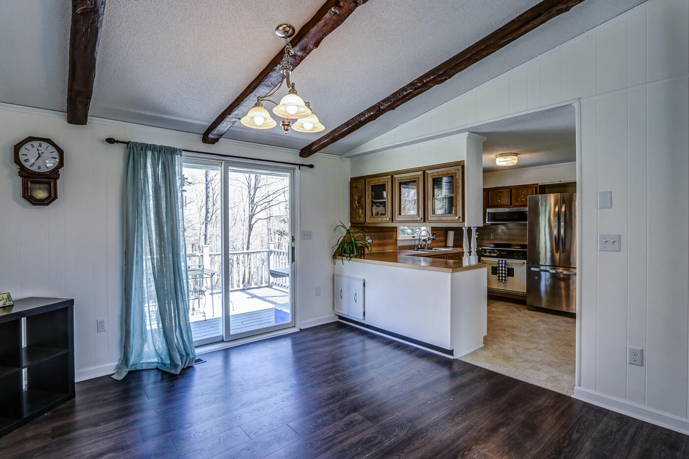 1306 Gills Road Bedford, VA 24523 - Photo 9 of 65 a kitchen with wooden floors and white appliances