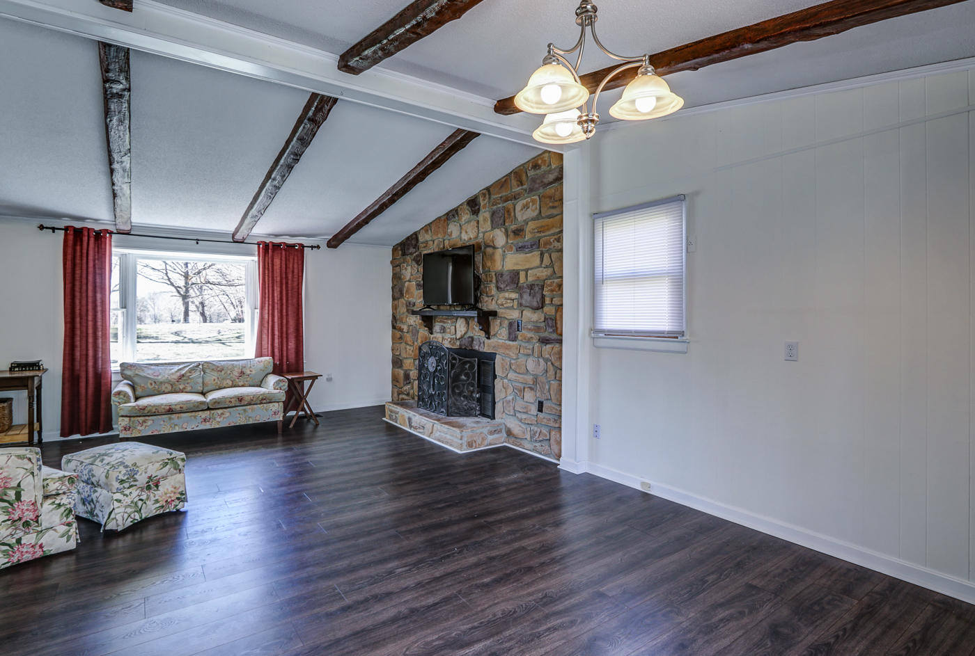1306 Gills Road Bedford, VA 24523 - Photo 10 of 65 a view of a livingroom with furniture wooden floor and a ceiling fan