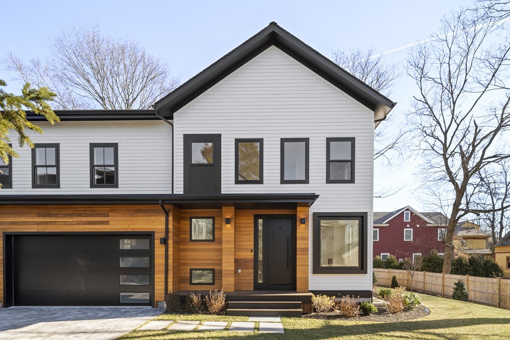 70 Walker Street, Unit 4 Newton, MA 02460 - Photo 1 of 1 a front view of a house with a yard