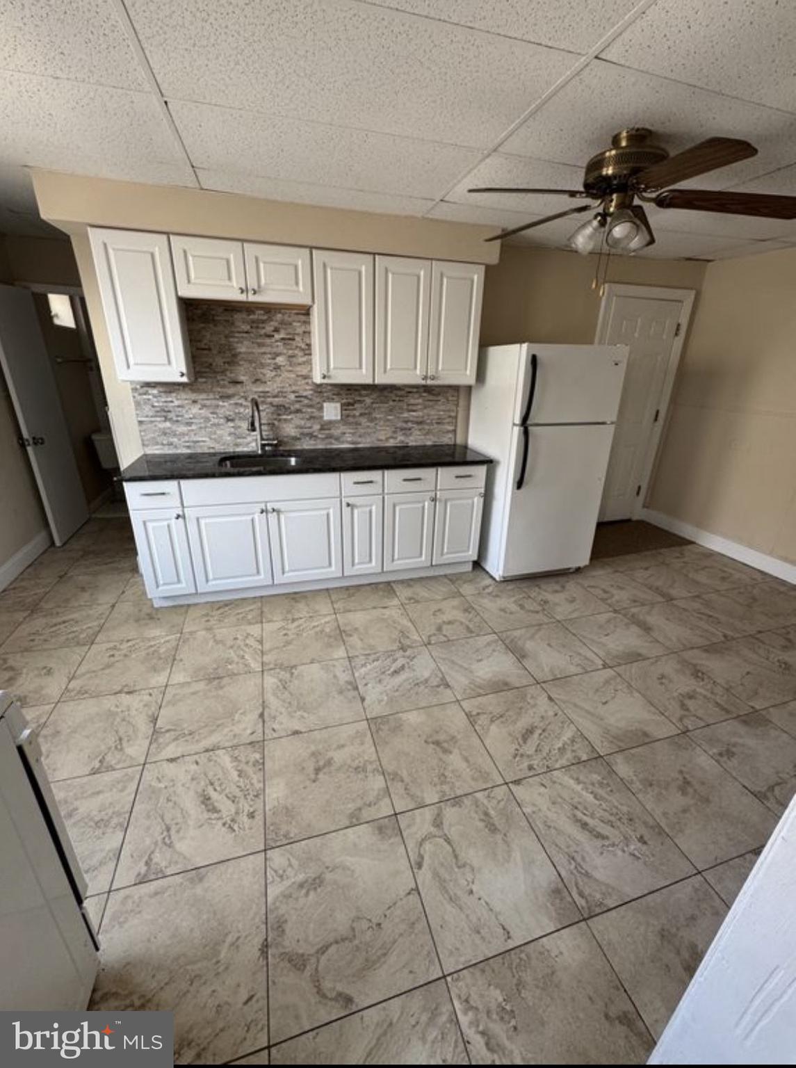 a view of a kitchen with kitchen and a window
