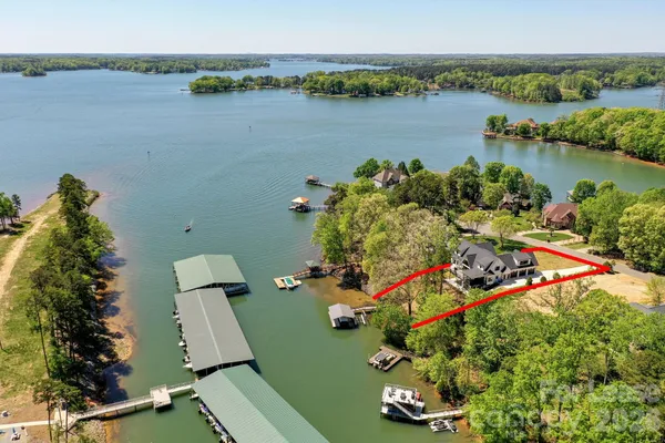 an aerial view of a house with a lake view