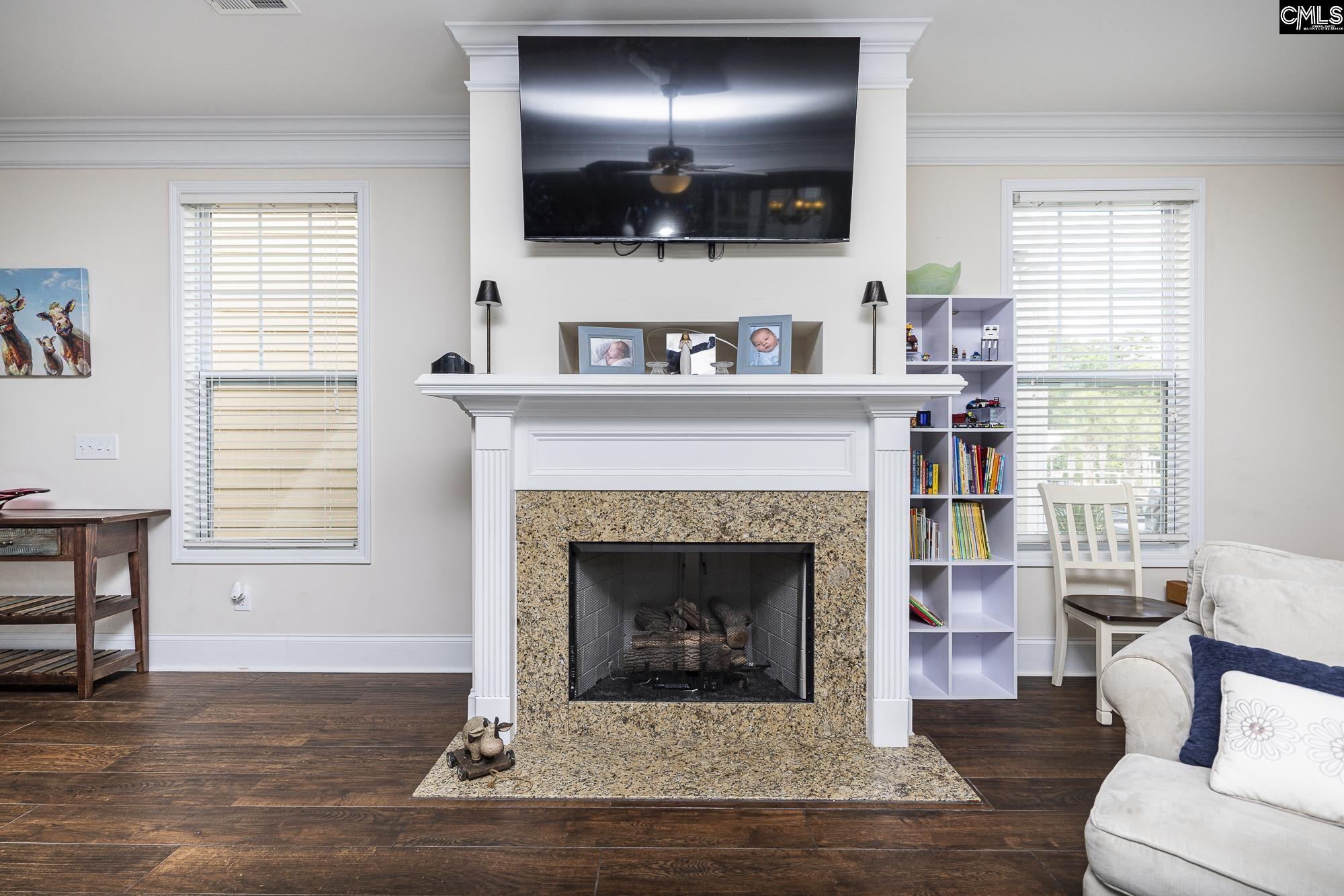 213 Sunset Point Drive Lexington, SC 29072 - Photo 8 of 35 a living room with furniture fireplace and flat screen tv