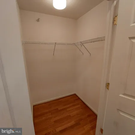 a view of an empty room with windows