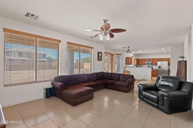 a kitchen with stainless steel appliances a refrigerator and a stove top oven