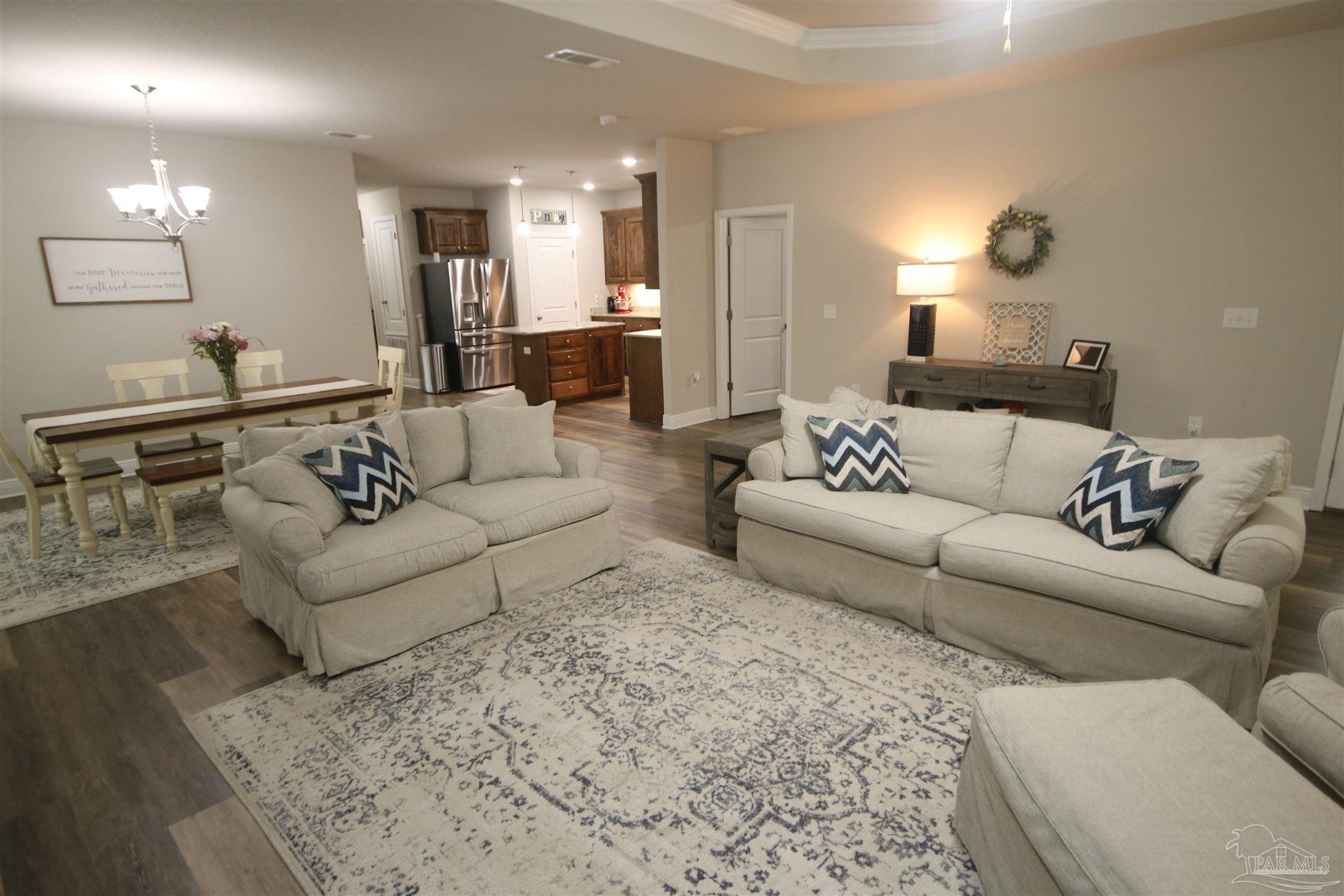 3849 Ranch Road Pace, FL 32571 - Photo 19 of 56 a living room with furniture and a couch