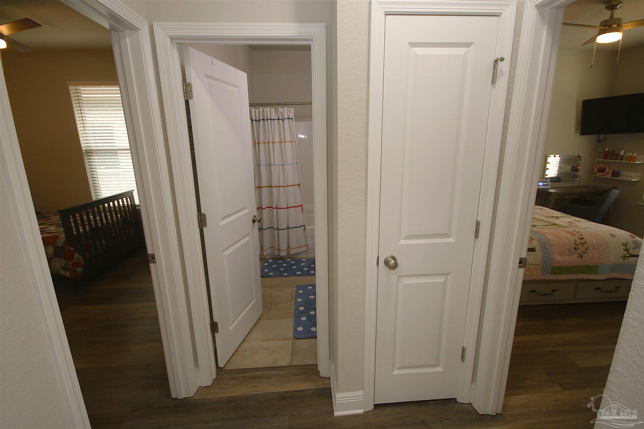 3849 Ranch Road Pace, FL 32571 - Photo 44 of 56 a view of a bathroom from a hallway