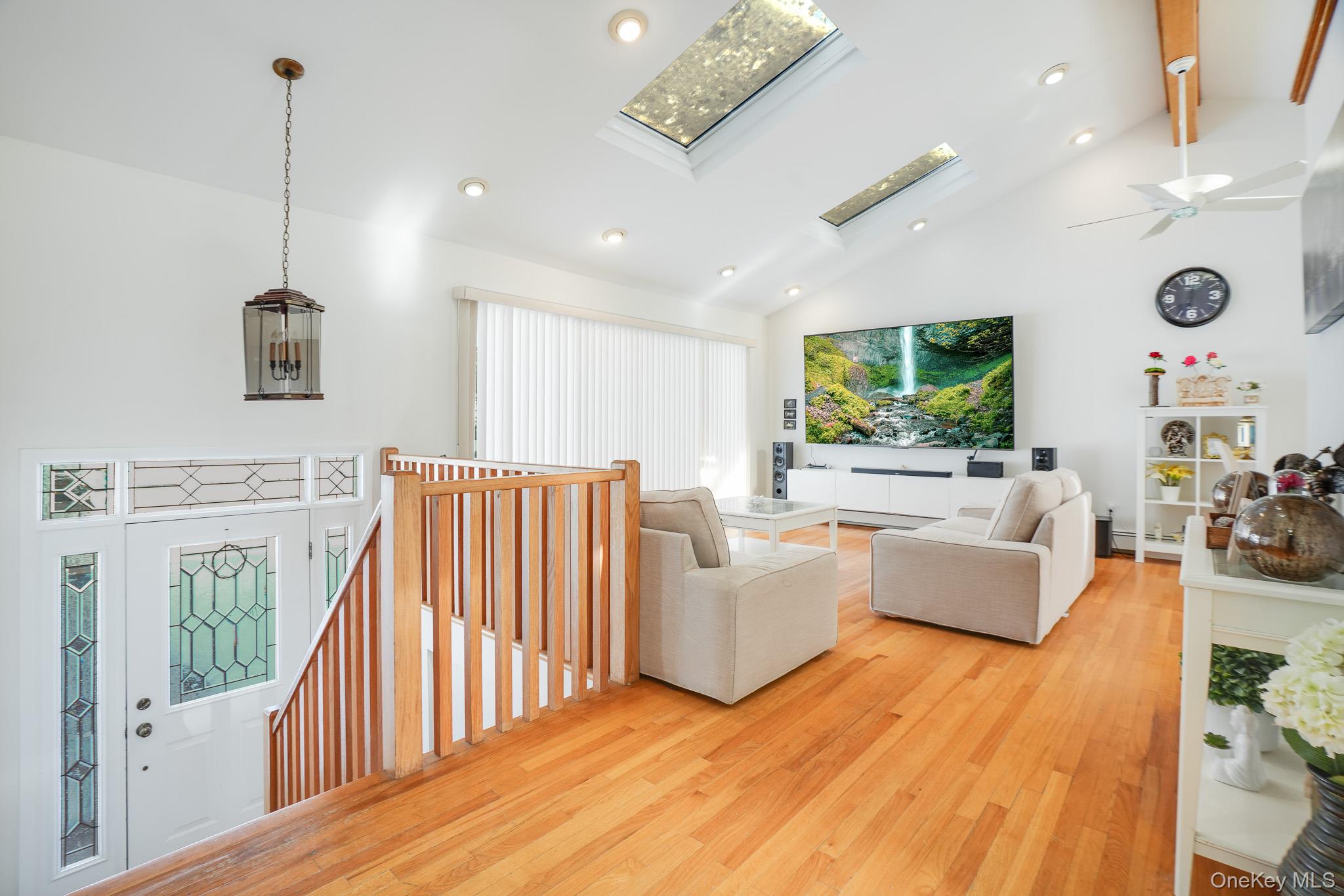53 Tanager Road Mahopac, NY 10541 - Photo 4 of 43 Living area featuring beamed ceiling, a skylight, high vaulted ceiling, and recessed lighting.