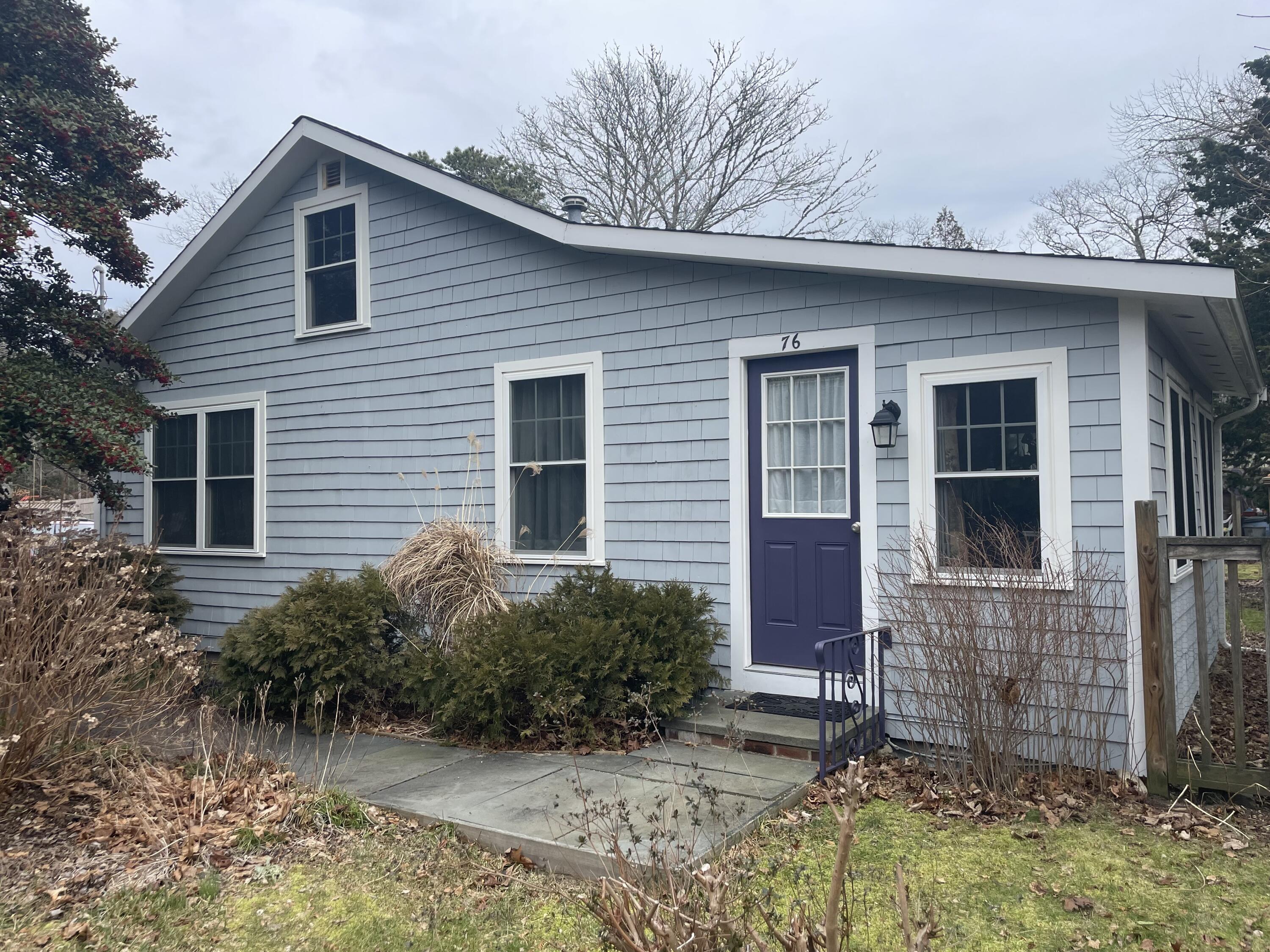 76 Camp Opechee Road Centerville, MA 02632 - Photo 1 of 37 a view of a house with a yard and plants
