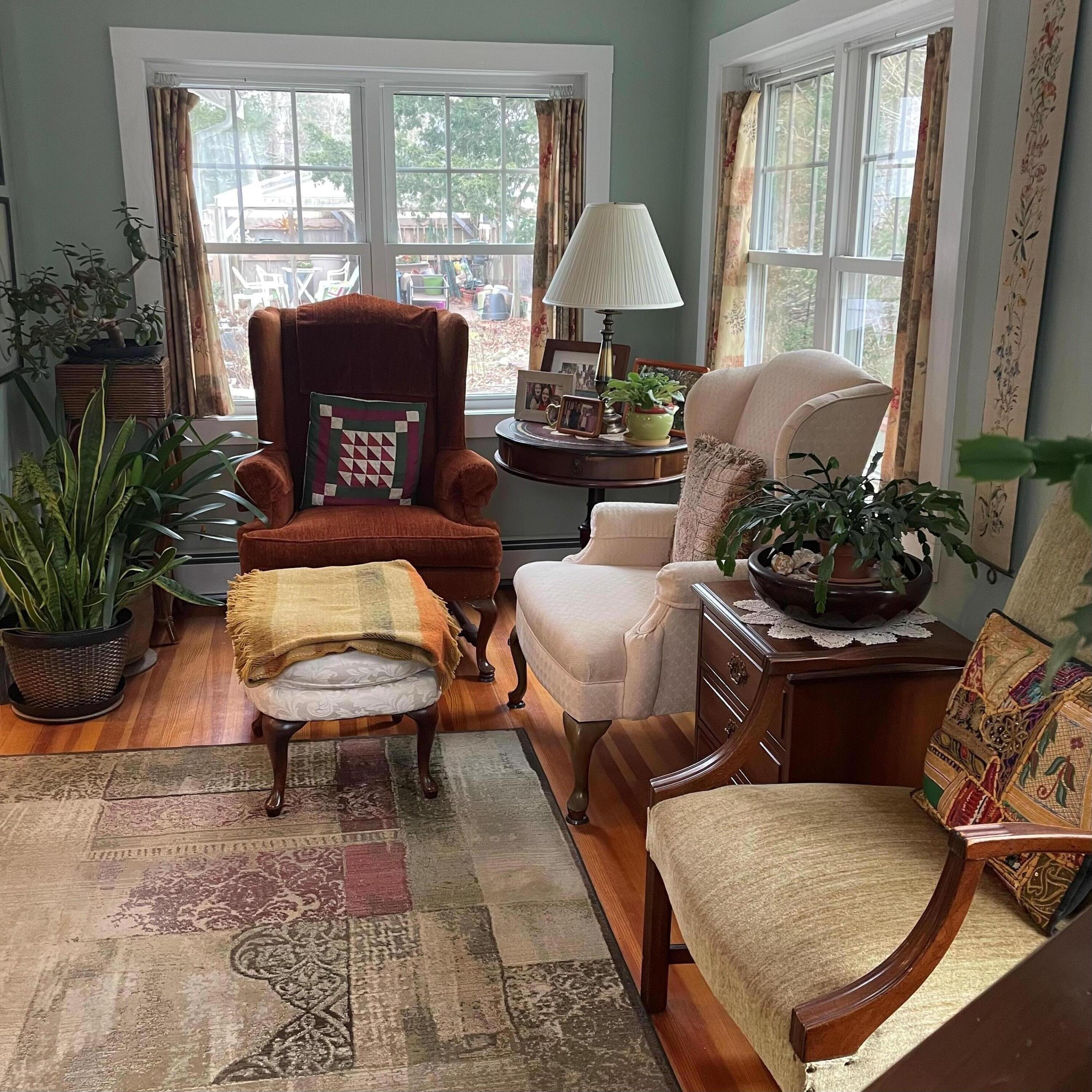 76 Camp Opechee Road Centerville, MA 02632 - Photo 2 of 37 a living room with furniture potted plant and a window