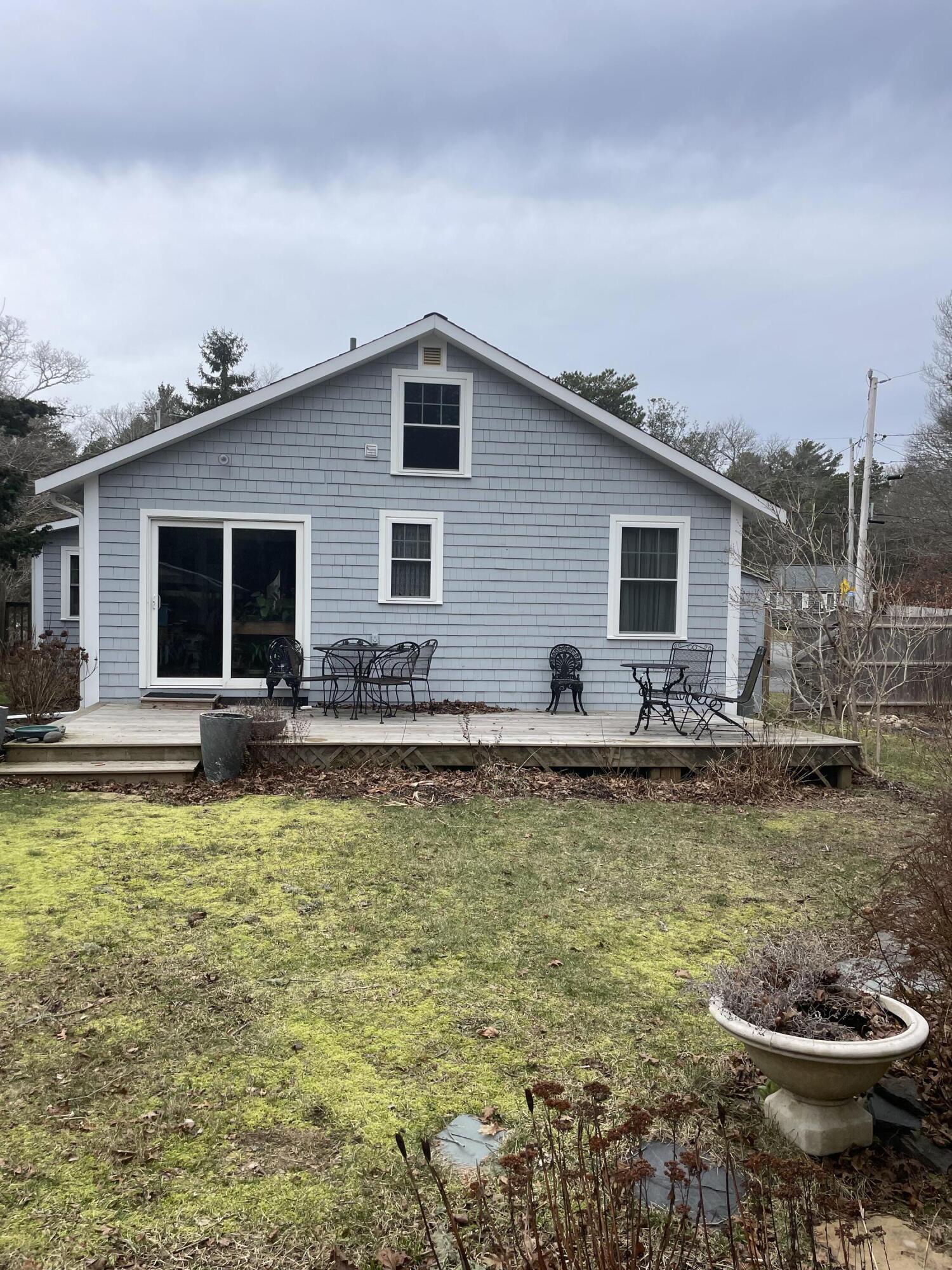 76 Camp Opechee Road Centerville, MA 02632 - Photo 23 of 37 a view of a swimming pool with a lounge chairs