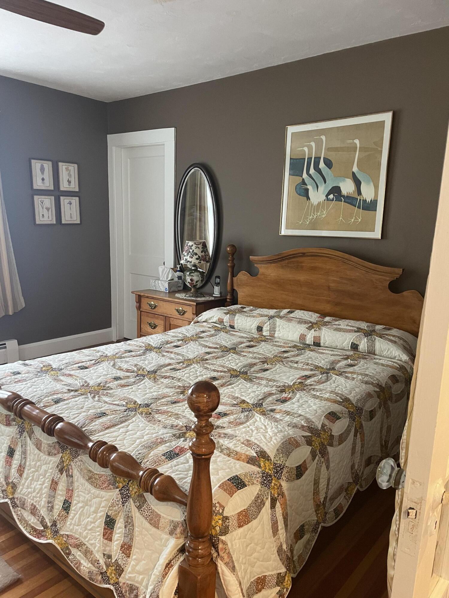 76 Camp Opechee Road Centerville, MA 02632 - Photo 5 of 37 a bedroom with a bed and a painting on the wall