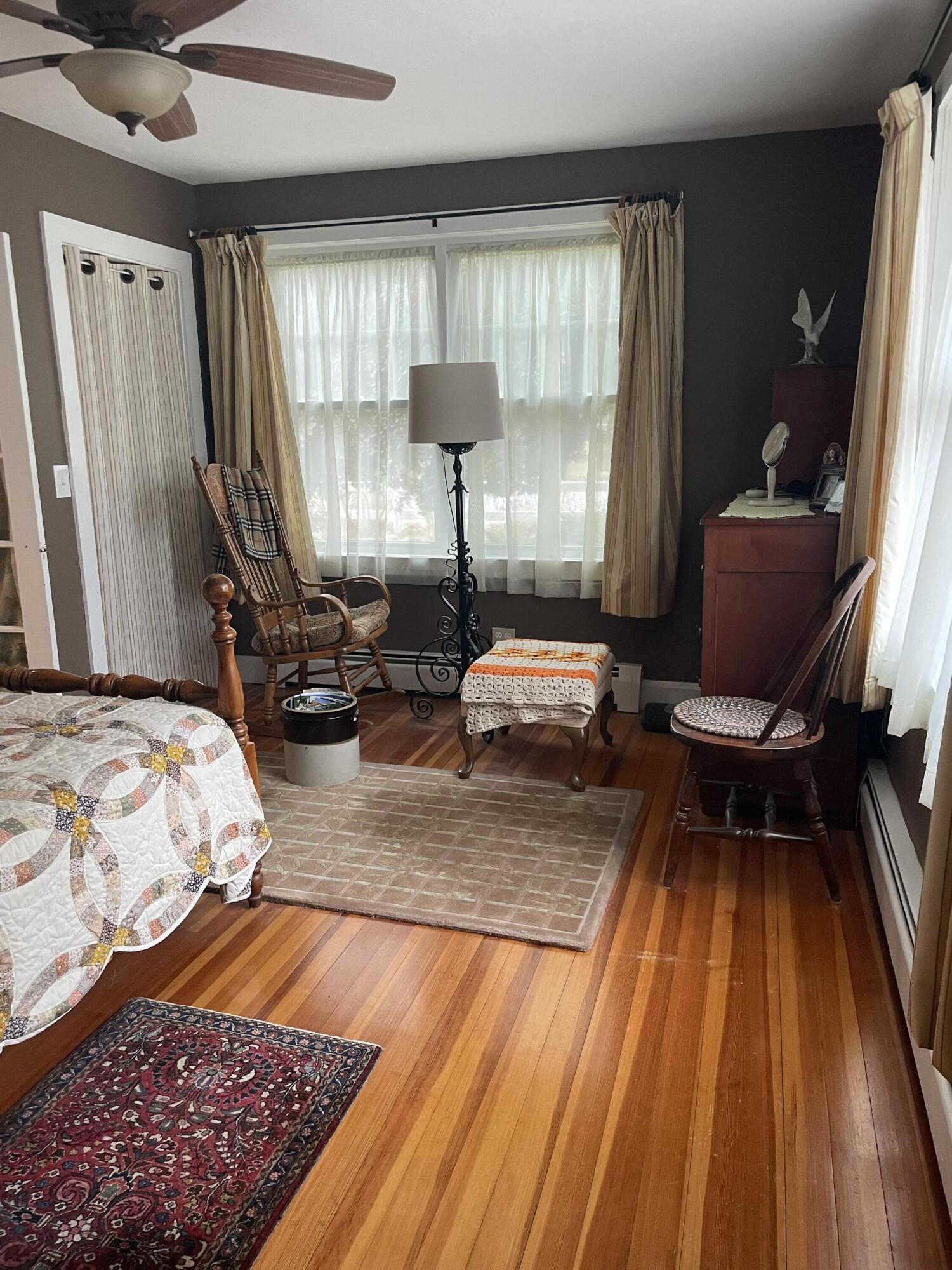 76 Camp Opechee Road Centerville, MA 02632 - Photo 7 of 37 a bedroom with a bed and wooden floor