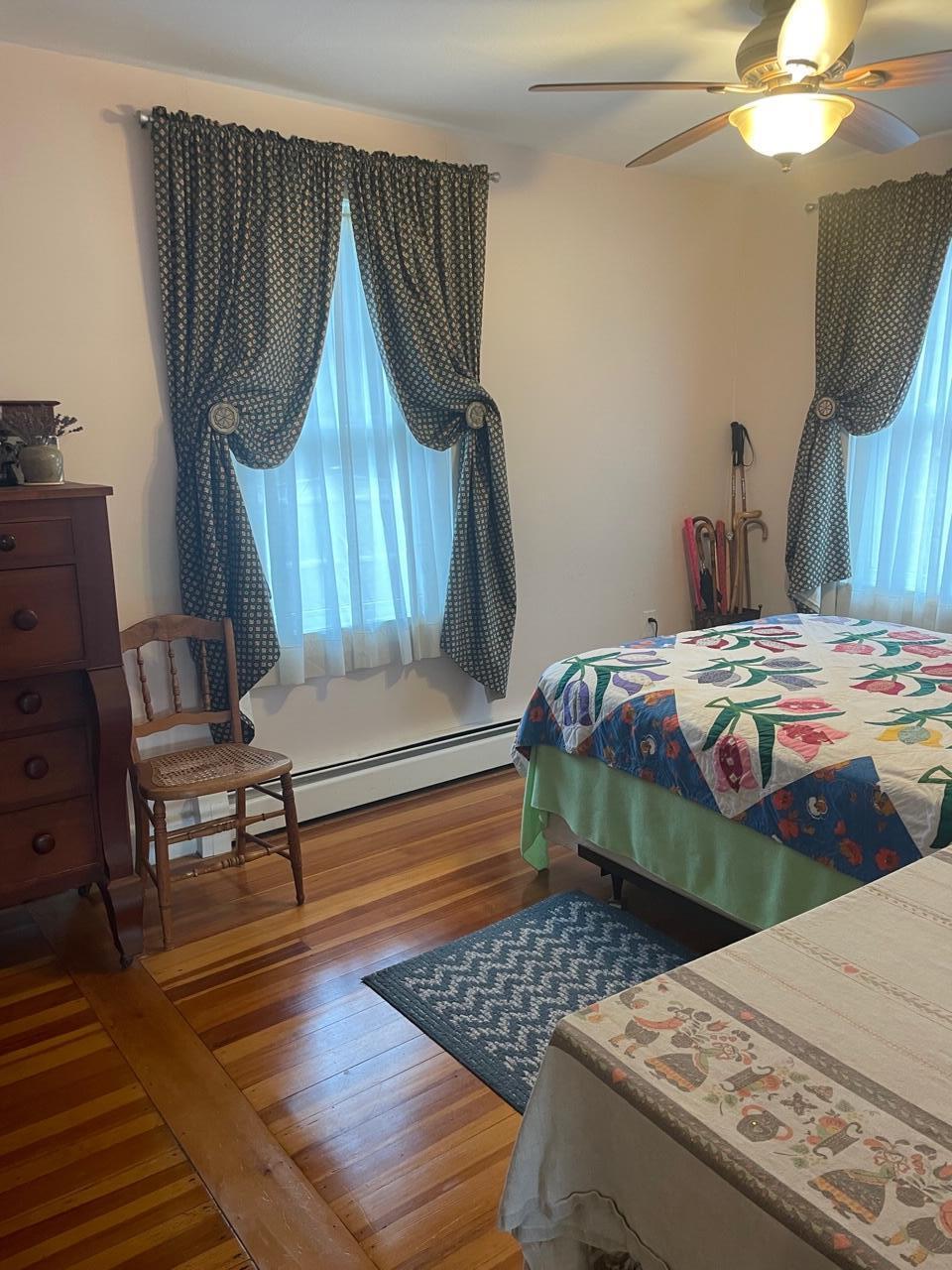 76 Camp Opechee Road Centerville, MA 02632 - Photo 8 of 37 a bedroom with a bed a rug and a dresser