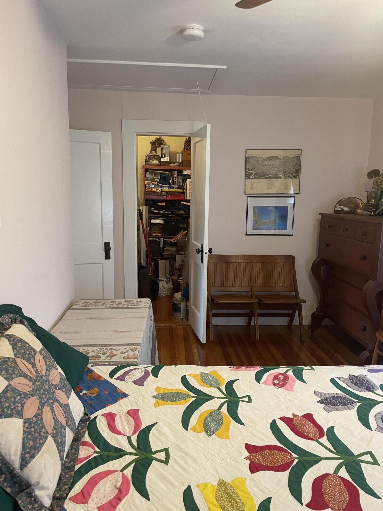 76 Camp Opechee Road Centerville, MA 02632 - Photo 10 of 37 a bedroom that has a bed and a table in it