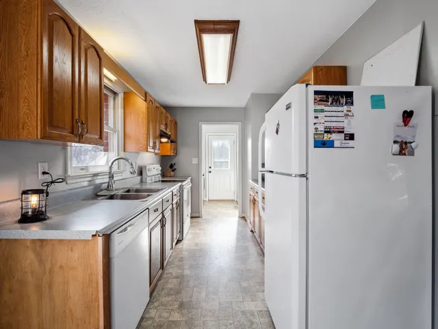 a kitchen with a refrigerator a sink and dishwasher