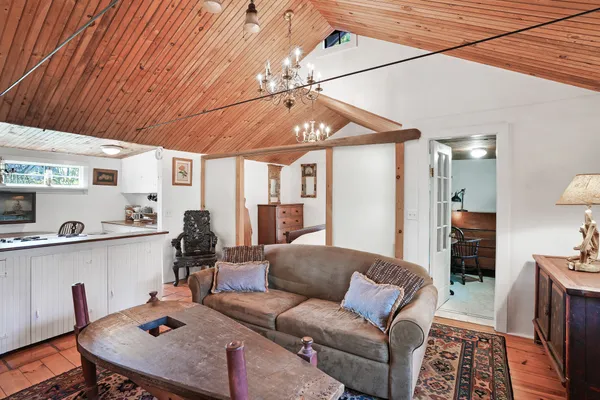 a living room with furniture and flat screen tv