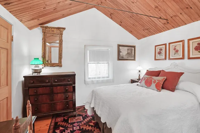 a bathroom with a sink a mirror and a shower