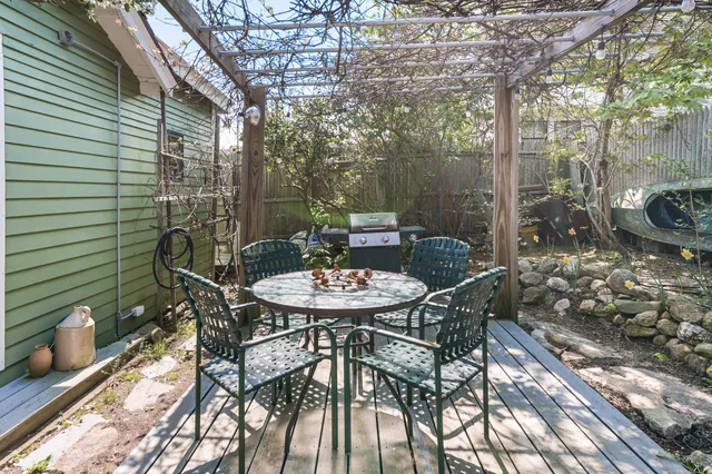 a yellow house with trees in front of it
