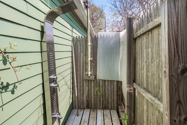 a view of a house with potted plants