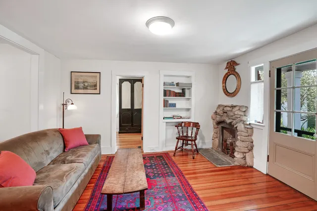 a open kitchen with stainless steel appliances granite countertop a sink a stove a dining table and chairs