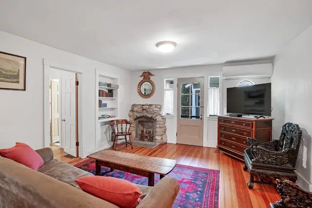 a bedroom with a bed and a lamp on table