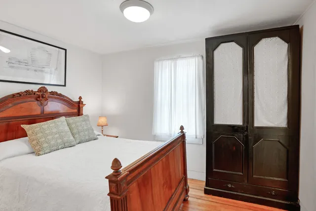 a workspace room with furniture and wooden floor