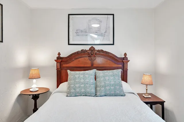 a bathroom with a sink a toilet and shower curtain