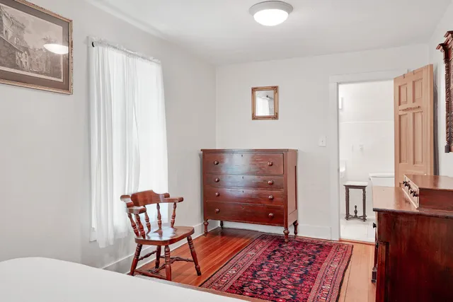 a view of a hallway with a white walls