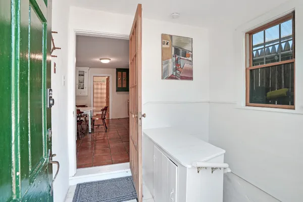 a view of a door and wooden floor