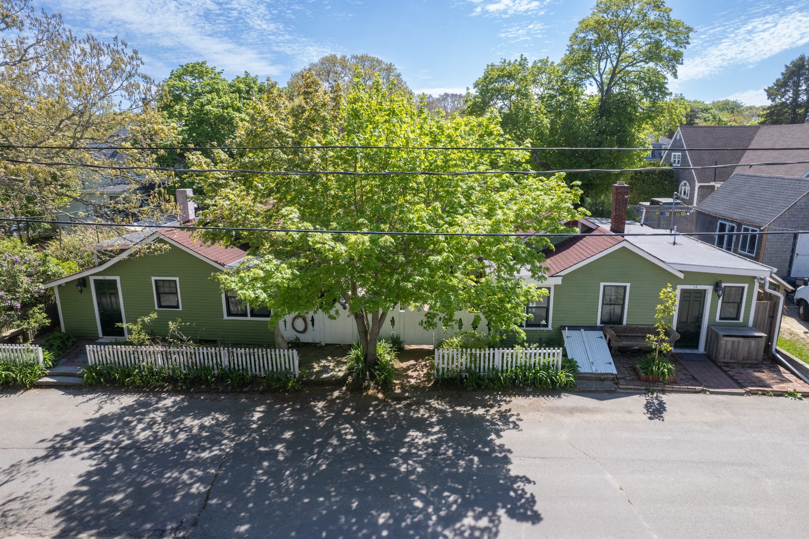 12 Maple Avenue Oak Bluffs, MA 02557 - Photo 53 of 55 a front view of a house with garden