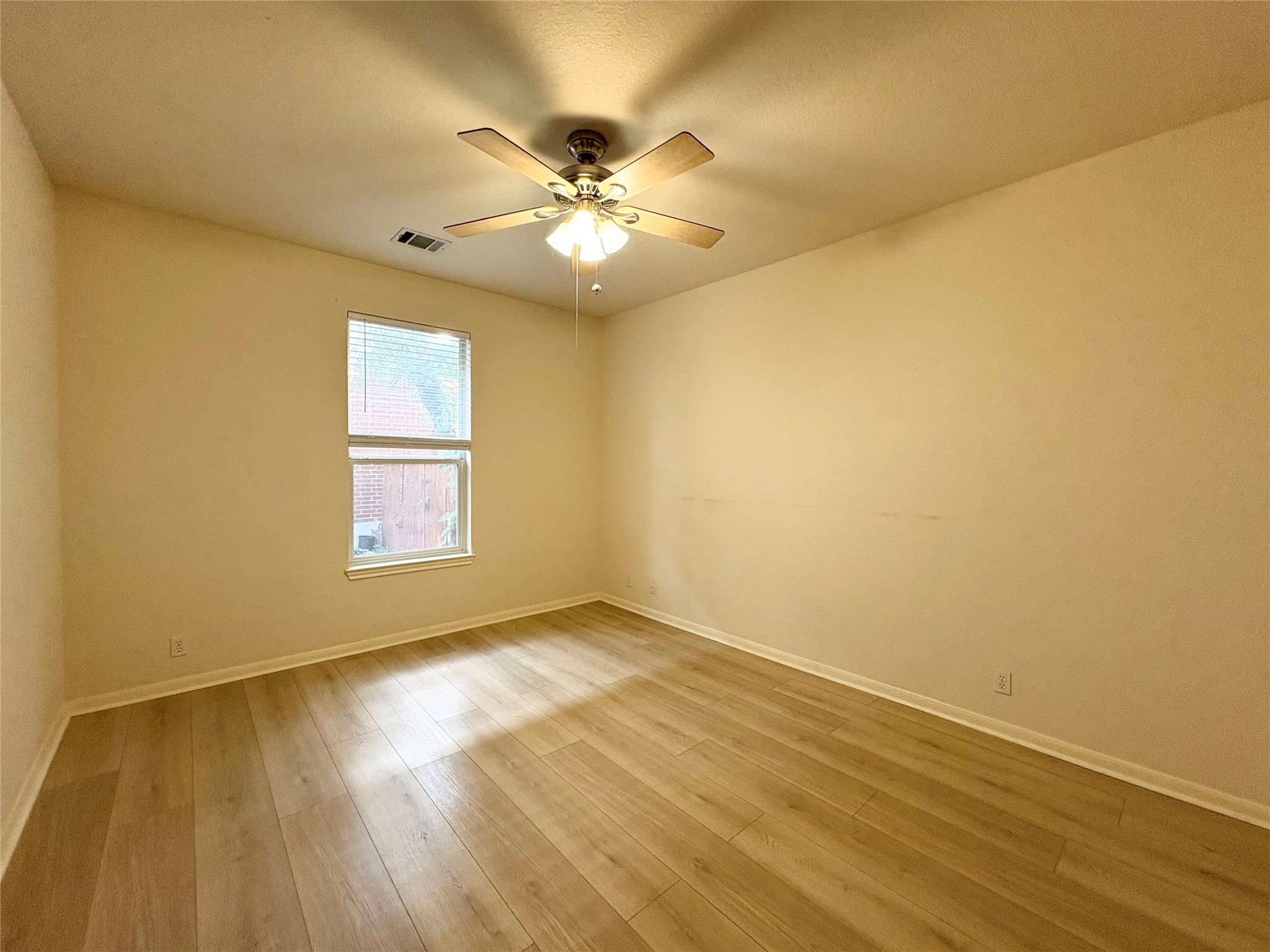 7006 Rambollet Terrace Round Rock, TX 78681 - Photo 26 of 38 Well-lit room features hard surface flooring and a classic ceiling fan for comfort.